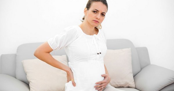 Чому болить живіт під час вагітності, причини і лікування