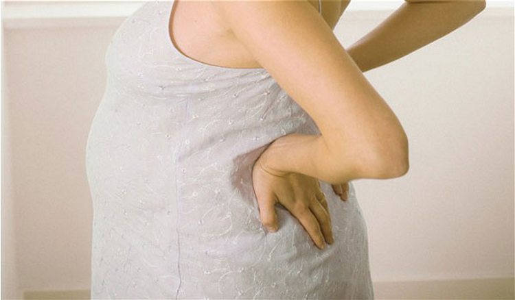 Чому болить поперек при вагітності
