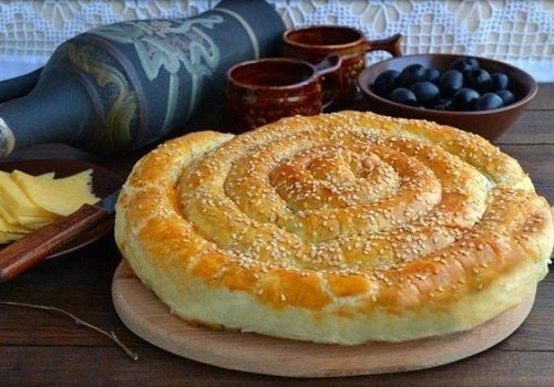 Спіральний пиріг з листкового тіста з начинкою домашній рецепт з фото простий