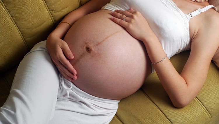 Болить пупок при вагітності: чому, що робити